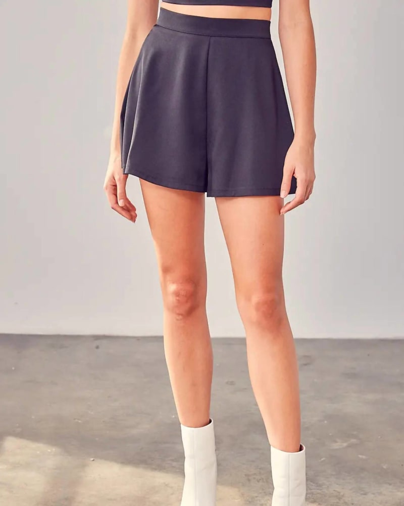 Front of a model wearing a size Large Flare Shorts In Black in Black by DO+BE. | dia_product_style_image_id:353522